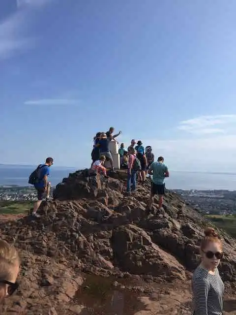People standing on top of Arthur's Seat