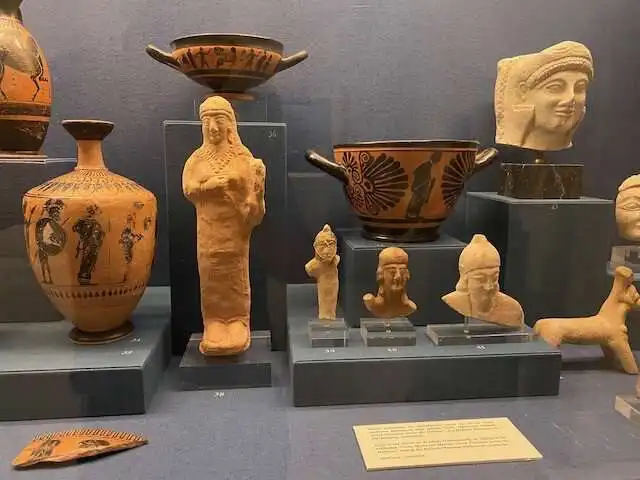 Various artifacts in one display case at the Benaki Museum of Greek Culture
