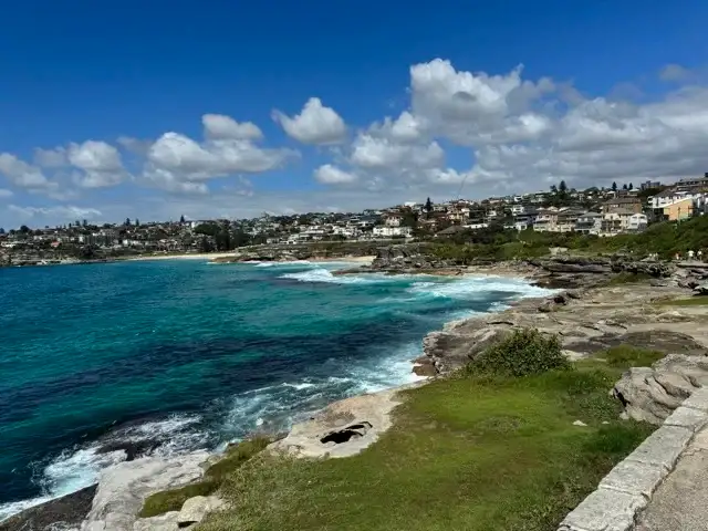 Ocean meets shore somewhat gently on the coastal walk from Bondi Beach