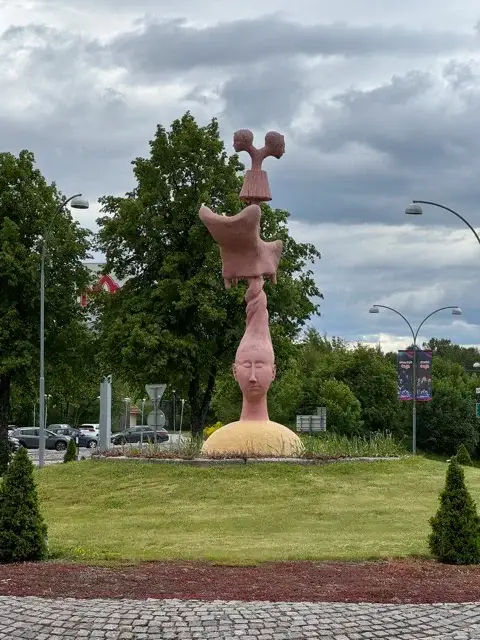 Statue in the traffic circle at the end of the linear park