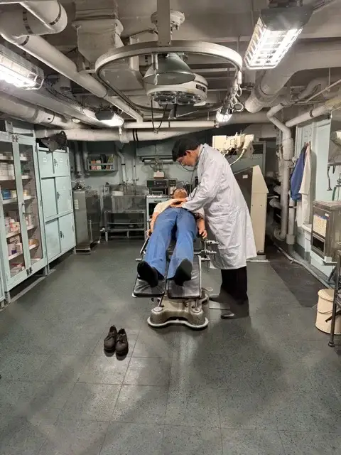 Mannequin doctor examining mannequin patient on the Fuji