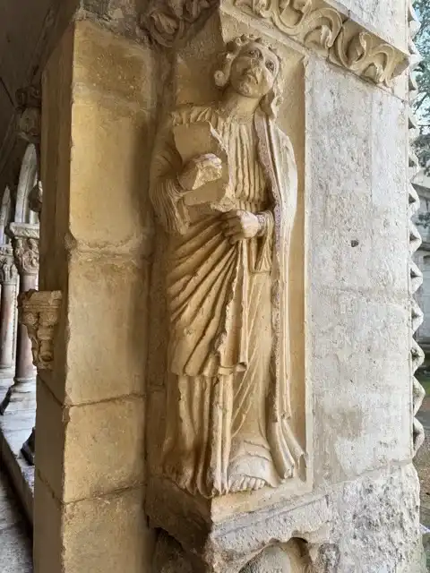 A statue on a pillar of Cloitre Saint-Trophime