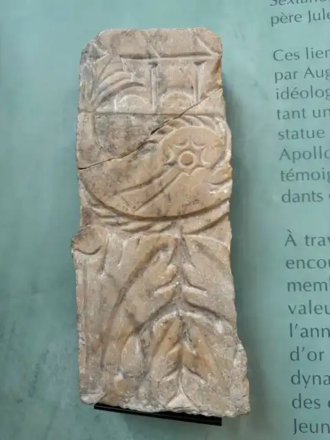 An architectural fragment engraved with a dolphin that has a comet for an eye