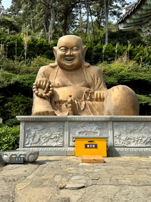 Giant happy sitting Buddha
