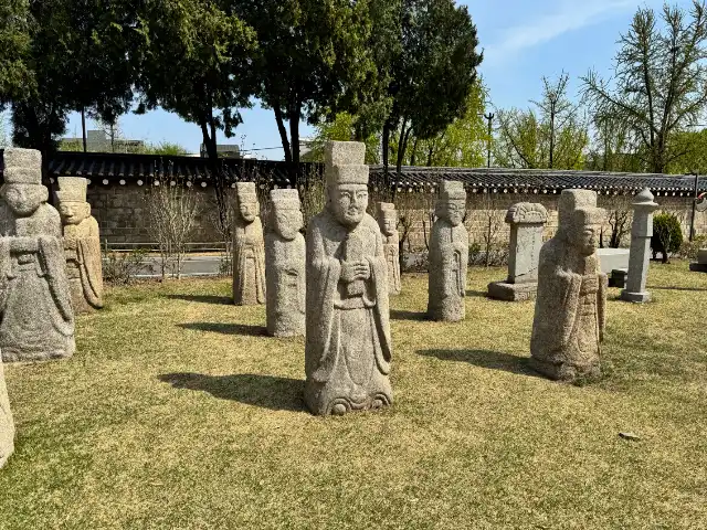 Funeral statues and stones outside at the National Folk Museum