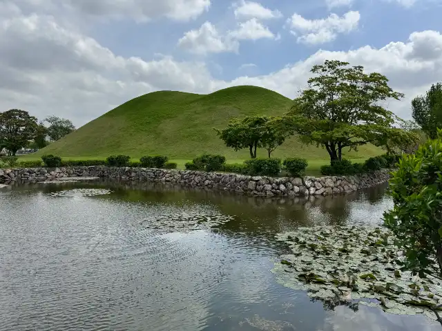 A mound behind a pond in the second park of the Daereungwon Ancient Tomb Complex