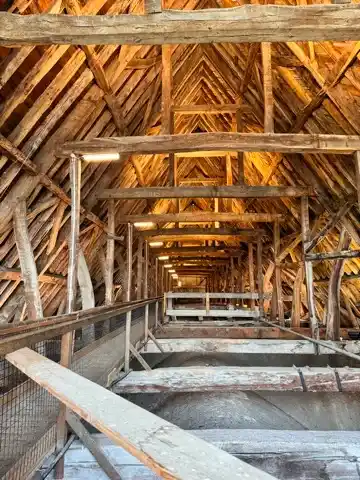 Looking between the top of the vaulted ceiling and the roof of the Salisbury Cathedral
