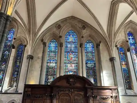 Stained-glass windows behind the altar