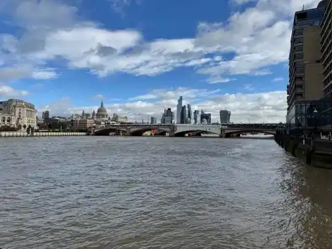 A view from a pier jutting out into the Thames